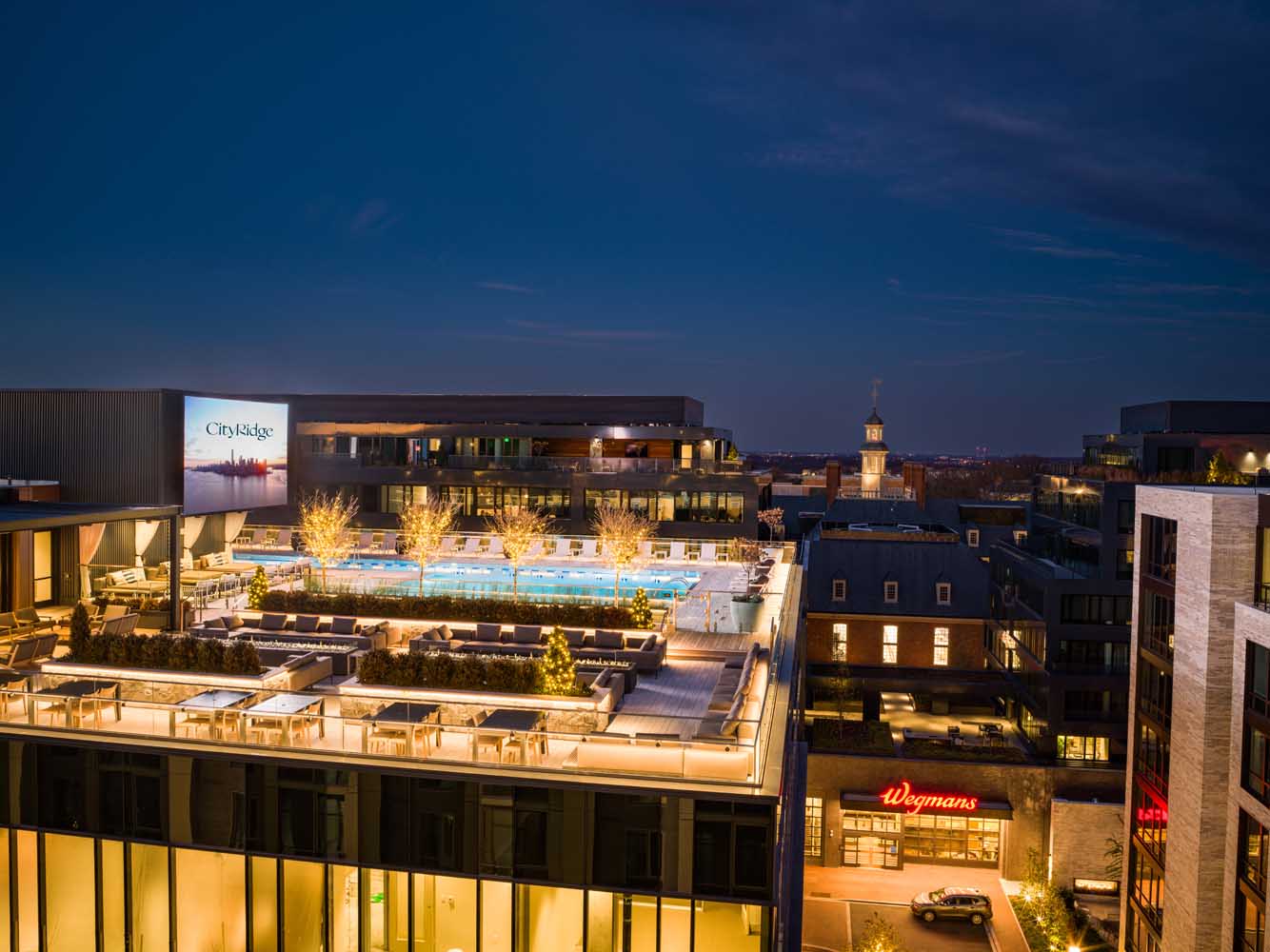 The Ridge Club is a rooftop oasis with boasting two pools, an outdoor theater screen and indoor-outdoor dining options
